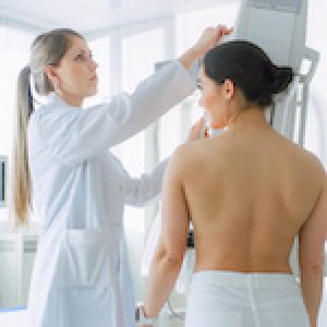 In the Hospital, Female Patients Undergoes Mammogram Screening Procedure Done by Mammography Technologist. Modern Technologically Advanced Clinic with Professional Doctors. Breast Cancer Prevention Screening.