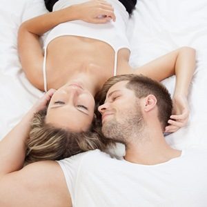 Young romantic couple in bed