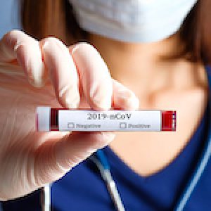 Nurse holding test tube with blood for 2019-nCoV analyzing. Novel Chinese Coronavirus blood test concept