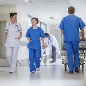 Doctors Hospital Corridor Nurse Pushing Gurney Stretcher Bed