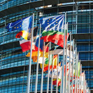 EU flags in front of Parliament waving in wind